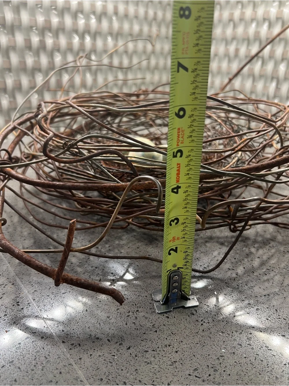 Metal rustic twig nest containing three artificial eggs decorative art